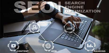 SEO text and icons overlayed on laptop image